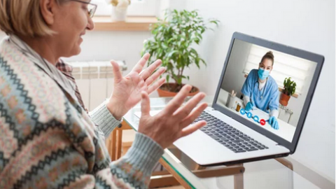 Women on computer talking to health care professional