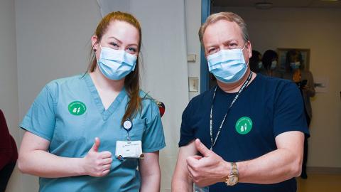 nurse and man with thumbs up