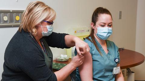 nurse receiving vaccine