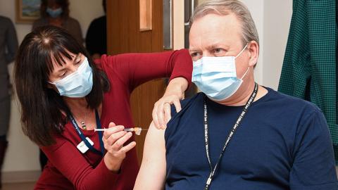 Dr. Jeffrey Betcher, ICU Physician, receives one of the first COVID-19 vaccinations in Saskatchewan on December 16, 2020.