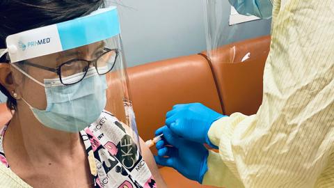 woman receiving vaccination