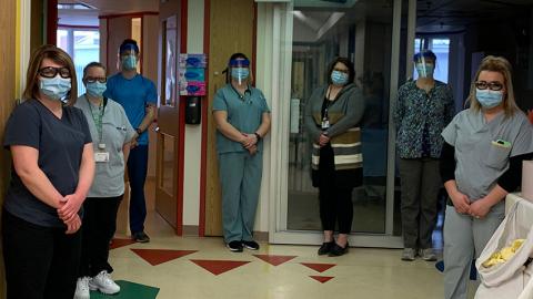 group of health care staff standing in a line