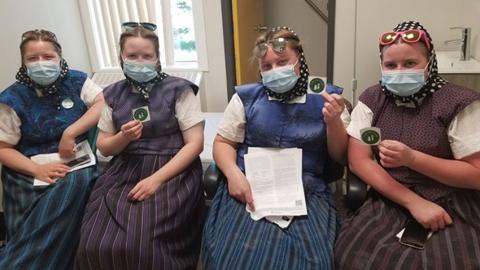 Hutterite community members after receiving their first dose of COVID-19 vaccine