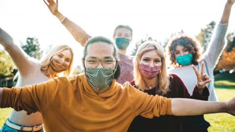 A group of people wearing masks