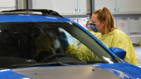 A person receives a COVID-19 test at a Regina Drive-Thru site. 