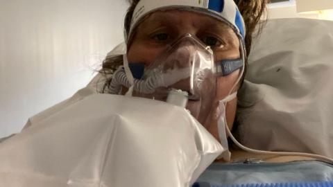 Kathy Ziglo in hospital, wearing oxygen mask.