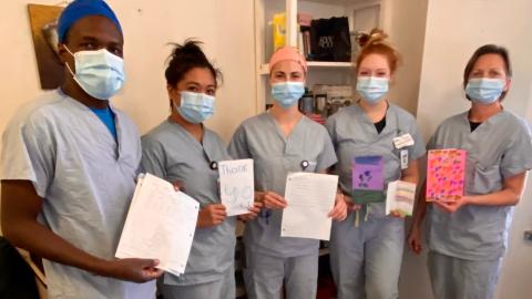 Nurses and students from RUH Medical Day Unit with the cards and letters sent by Fairhaven students.