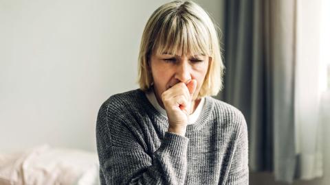 Woman coughing. 