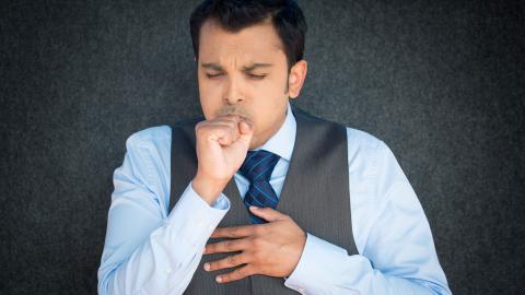 Man coughing. 