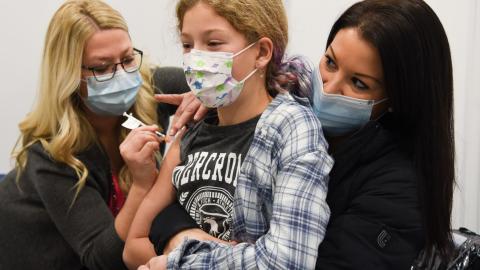 child receiving vaccinations