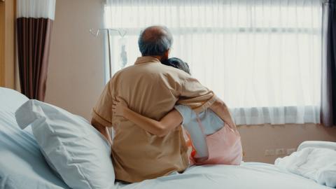 grandpa hugs granddaughter while in hospital