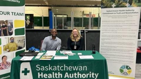 Managers at a booth at the Lac La Ronge career fair