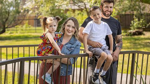 Family of four in park in fall