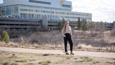New respiratory therapist in front of Jim Pattison Children’s Hospital