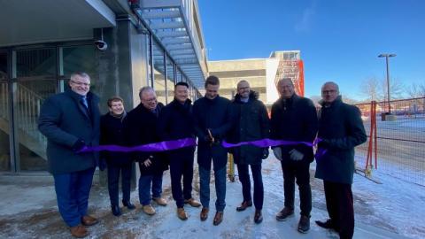 People standing for ribbon cutting of parkade