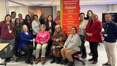 Saskatchewan Health Authority staff at Battlefords Union Hospital unveil new palliative care door decals created by the Battle River Treaty 6 Health Centre.