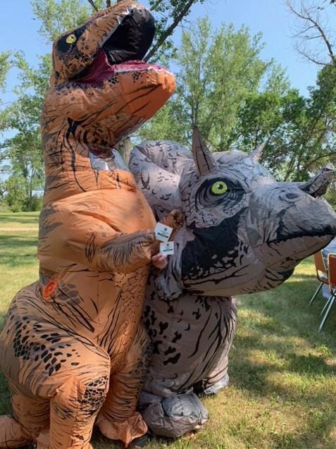 Registered nurses wore blow up dinosaur costumes while immunizing beach-goers at Pasqua Beach on July 10.