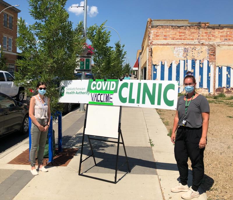 Immunizers Kristina Dewald [left] and Kennedy Weinmeister are helping North Battleford and area finish the fight against COVID-19.