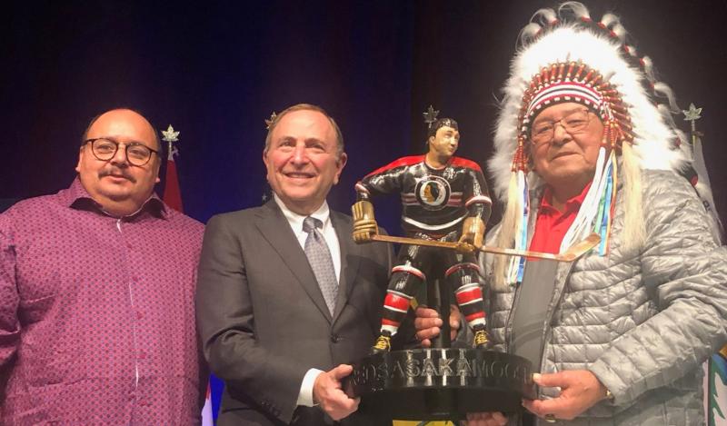 Neil Sasakamoose (left) with his father, Fred Sasakamoose (right) and NHL Commissioner Gary Bettman. Photo courtesy the Sasakamoose family.