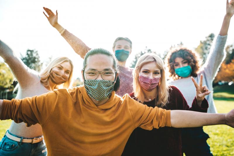 A group of people wearing masks