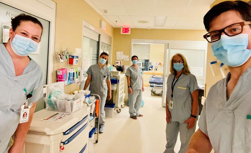 Dr. Kevin Wasko (right) on shift with Registered Nurses in the Emergency Department in Swift Current. 