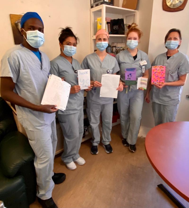 Nurses and students from RUH Medical Day Unit with the cards and letters sent by Fairhaven students.