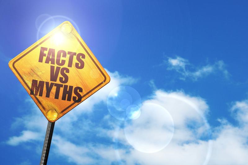 Stylized road sign that reads, “Facts vs Myths”