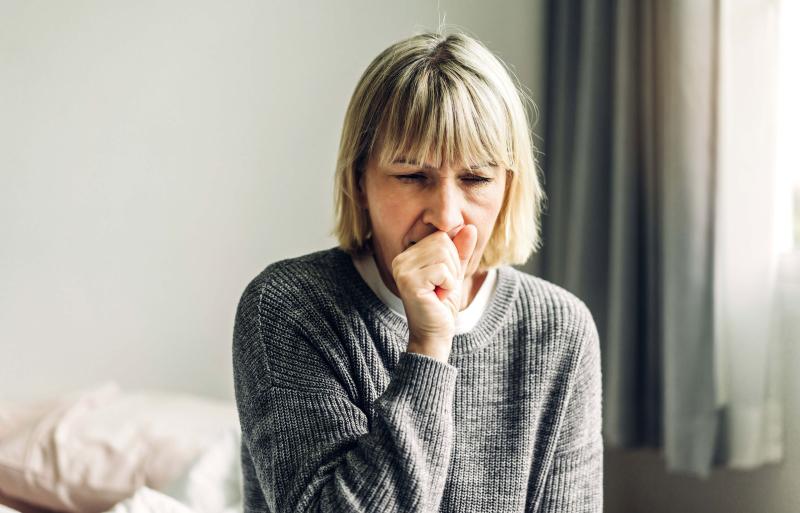 Woman coughing. 