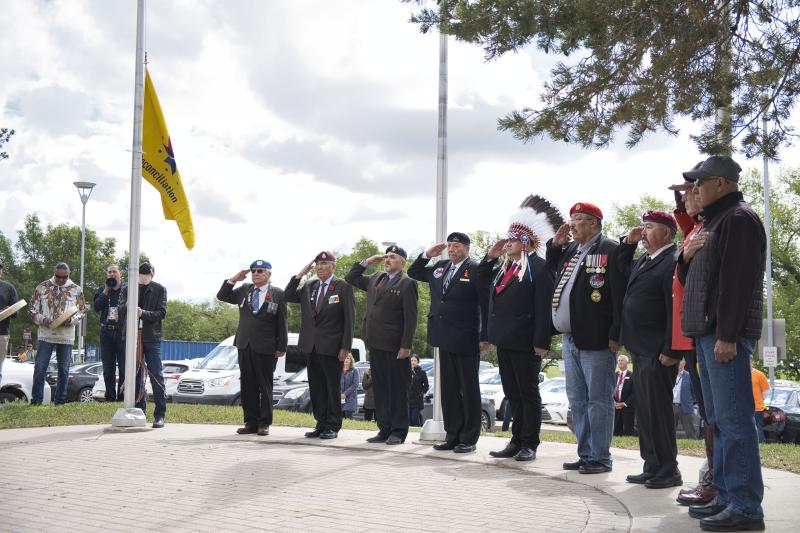 First Nations and Métis veterans, led by Grand Chief Dave Gamble, salute the raising of the Truth and Reconciliation Flag at the SHA corporate head office at Saskatoon City Hospital on June 21. 