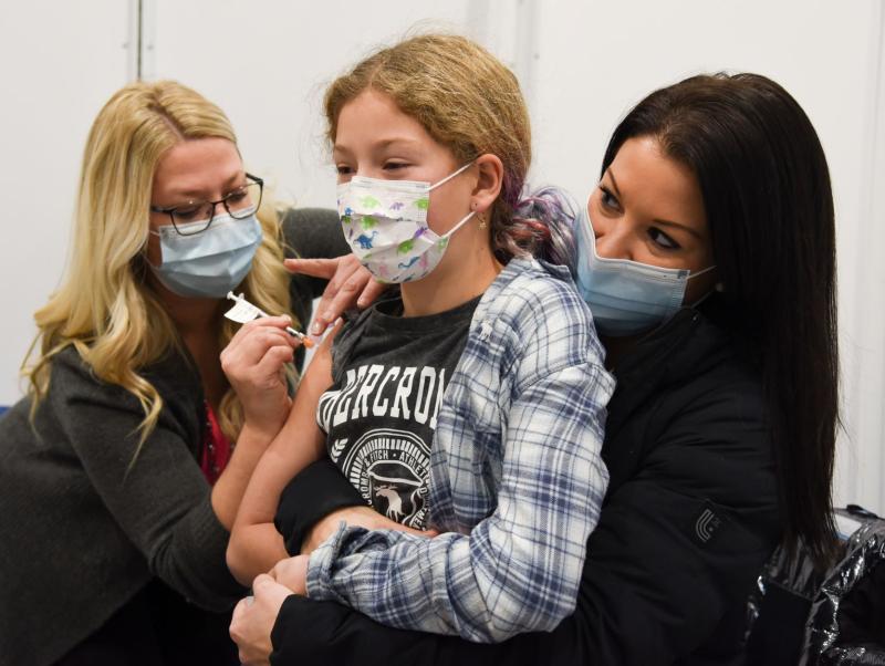 child receiving vaccinations