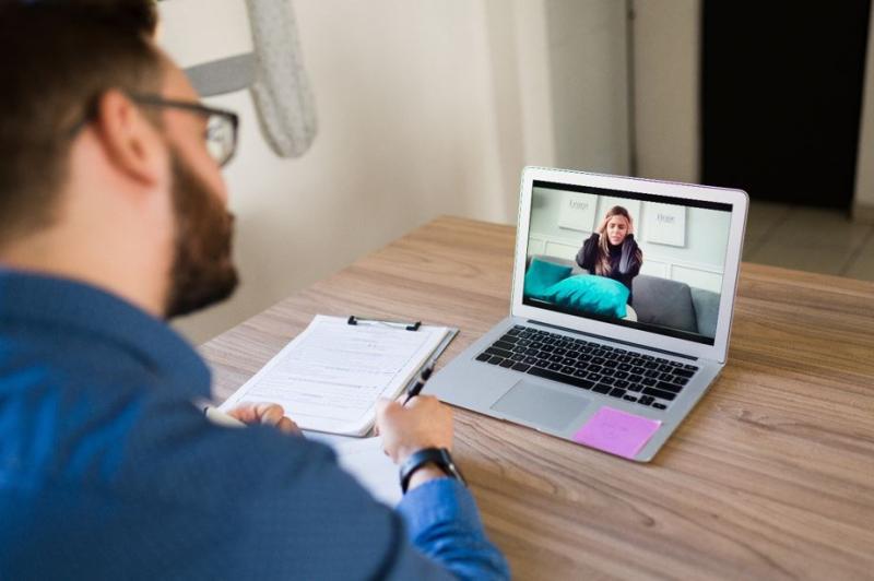 therapist meeting virtually with client