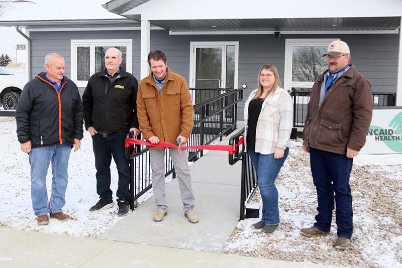 Local community representatives and project partners celebrate the grand opening of the clinic on November 23, 2023