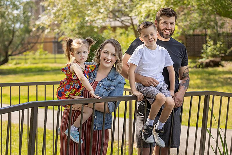 Family of four in park in fall