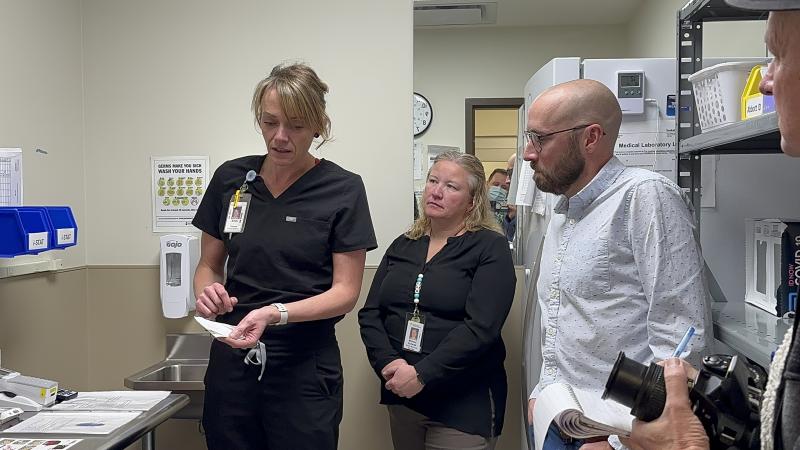 LPN demonstrating point of care testing equipment in Maple Creek