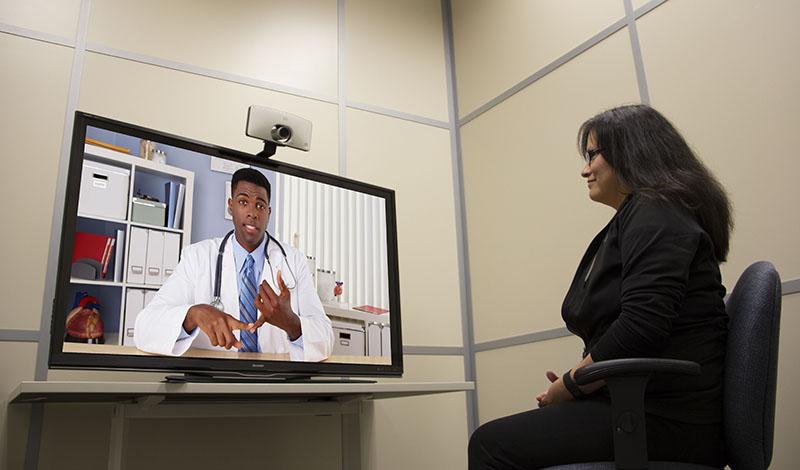 A patient connects with a health-care worker via Telehealth