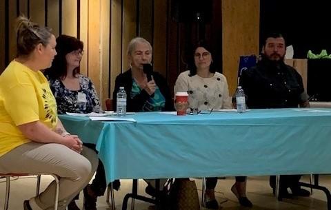 People sitting at a table at the Kamsack wellness event