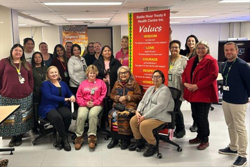 Saskatchewan Health Authority staff at Battlefords Union Hospital unveil new palliative care door decals created by the Battle River Treaty 6 Health Centre.